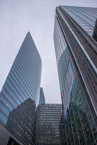 city curtain wall buildings under white sky office building