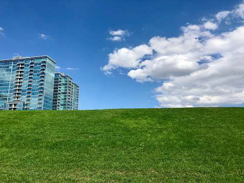 city curtain wall high-rise building under blue sky high rise