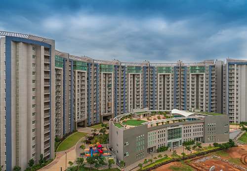 city gray and blue concrete buildings at daytime close-up photography high rise