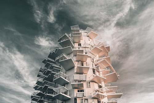 city gray concrete building during daytime high rise