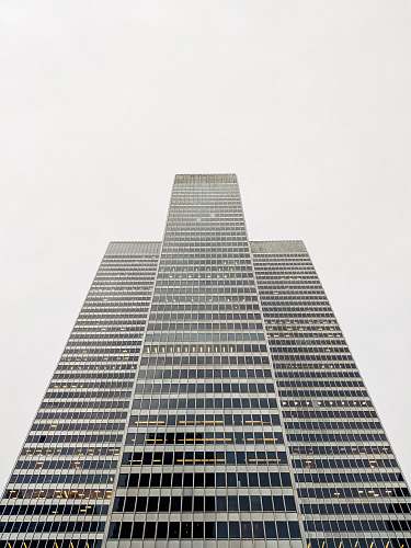 city gray tower building on gray sky architecture
