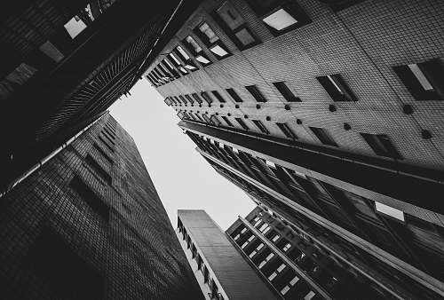 city grayscale photo of building black-and-white
