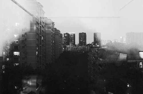 city grayscale photo of city buildings black-and-white
