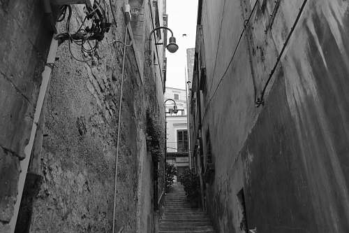 city grayscale photo of pathway and staircase black-and-white