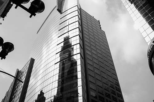 city grayscale photography of curtain wall building black-and-white