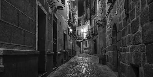 city grayscale photography of pathway black-and-white