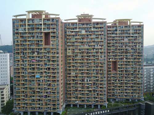 city high-angle photography of brown high-rise building high rise