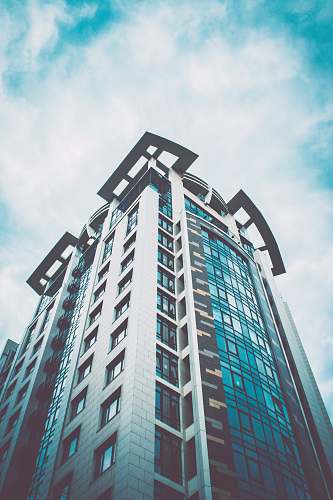 condo high rise building under white sky during daytime housing