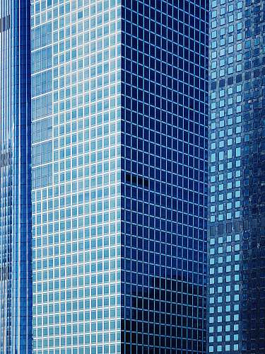 city high-rise building with glass windows view urban