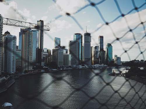 city highrise buildings near sea during daytime town