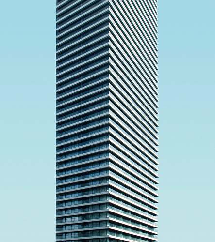 city low angle photo of curtain glass wall building urban