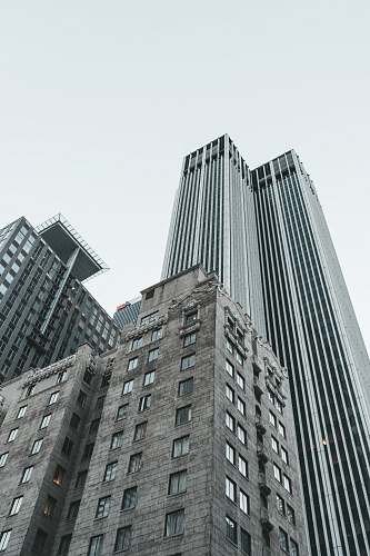 city low angle photo of gray concrete building office building