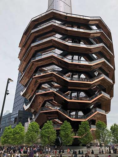 city low-angle photography of brown multi-storey building during daytime high rise