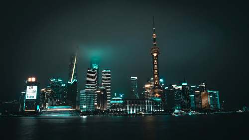 city low angle photography of city near body of water metropolis