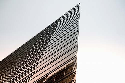 urban low-angle photography of curtain building under white sky during daytime office building