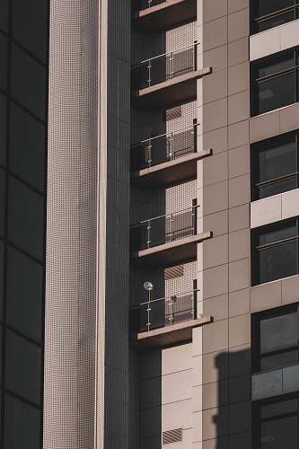 city low-angle photography of gray and black building high rise