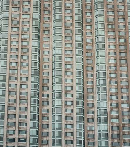 city low-angle photography of gray concrete high-rise building during daytime high rise