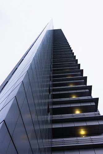 urban low angle photography of gray high rise building office building