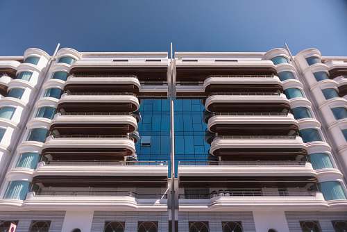 city low-angle photography of grey concrete apartment high rise