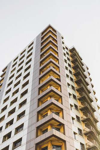 condo low-angle photography of high-rise building at daytime housing