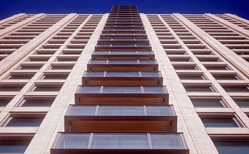city low angle photography of highrise multi-storey building high rise