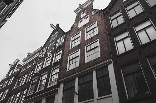 city low-angle photography of house high rise