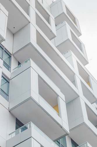 city low-angle photography of white concrete multi-storey building urban