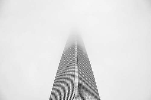 city low angle view photography of gray building black-and-white