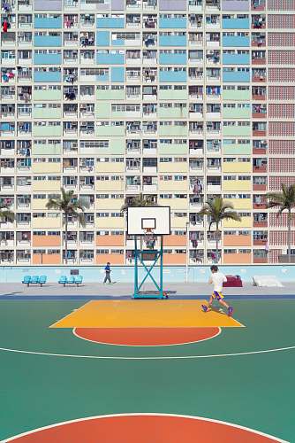 city man running on basketball court during day time basketball