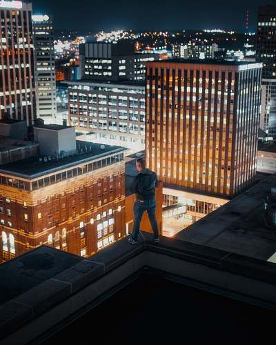 city man standing on rooftop urban