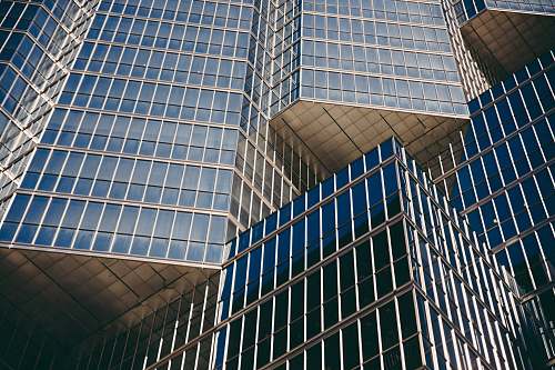 urban man's eye view of high rise building during daytime architecture
