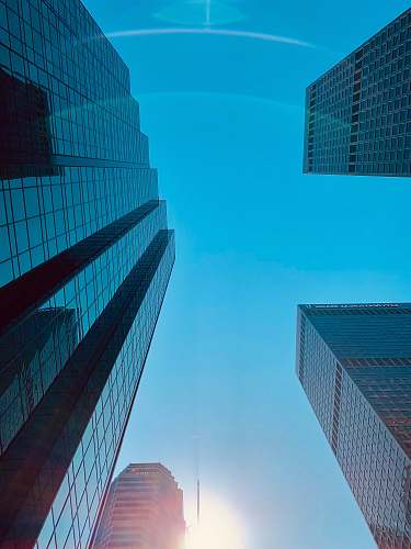 city mirror high rise buildings during daytime office building