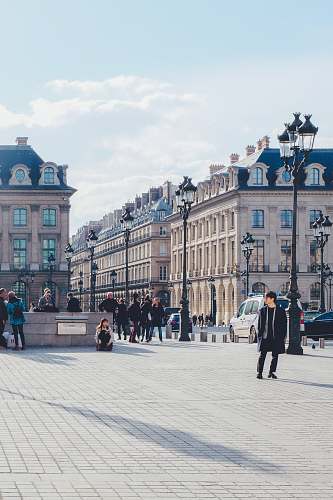city people near building during daytime downtown
