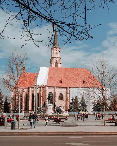 city people near cathedral during day architecture