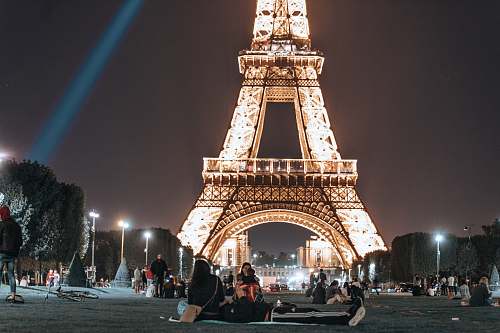 city people near Eiffel Tower downtown