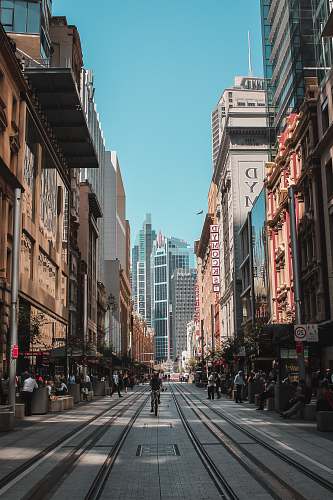 city people on marker beside road urban