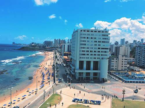 city people on shore beside building during daytime downtown