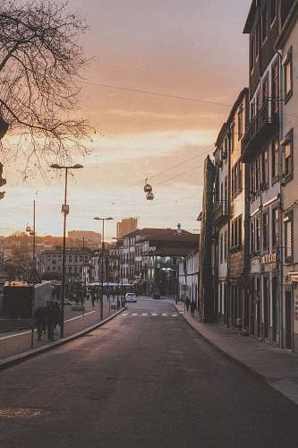city people walking beside street road