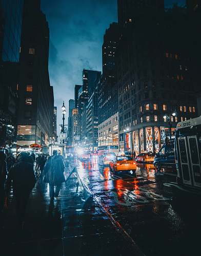 city people walking on street at nighttime metropolis