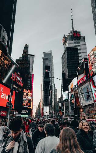 city people walking on street during daytime metropolis