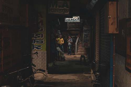 city person standing beside stairs road