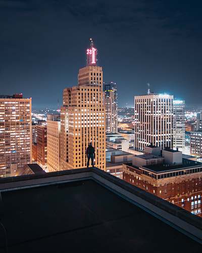 city person standing on the edge of the building urban