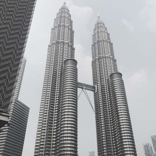 black-and-white Petronas Twin Towers - KLCC, Kuala Lumpur City during day grey