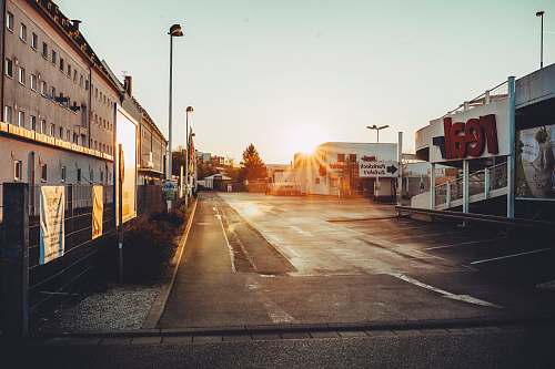 city road way beside building during daytime urban