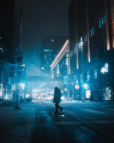 city silhouette of man walking on pedestrian lane urban