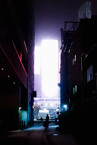town silhouette of person walking on street road