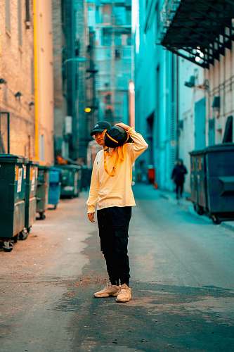town standing man near buildings street