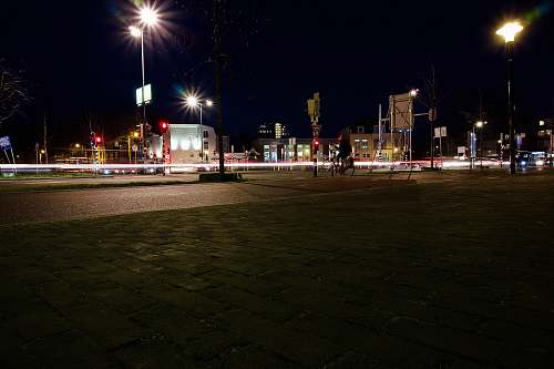 city stop light turned on during nighttime downtown