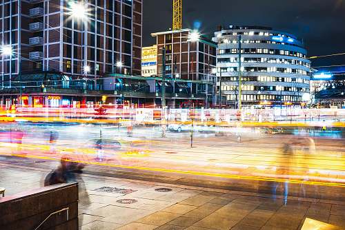 city time lapse photo of cars on road during nighttime metropolis