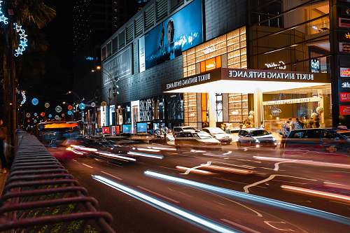 city time-lapse photography of vehicles on road during nighttimes metropolis